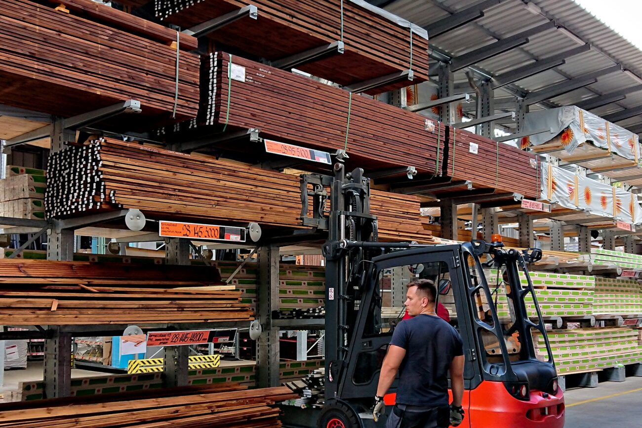 working-guy-working-in-open-air-warehouse-of-build-2025-01-08-10-34-03-utc